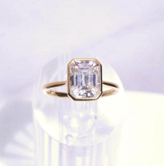 14k Gold Emerald Cut Moissanite Casey Ring: Lightweight Bezel Setting