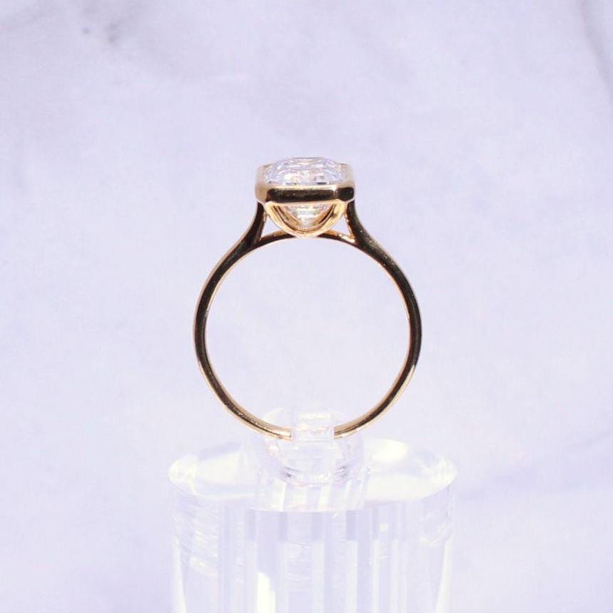 14k Gold Emerald Cut Moissanite Casey Ring: Lightweight Bezel Setting