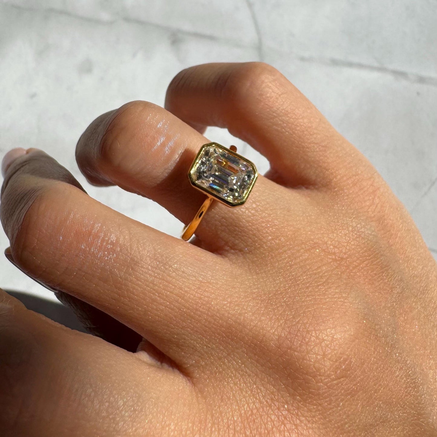 14k Gold Emerald Cut Moissanite Casey Ring: Lightweight Bezel Setting