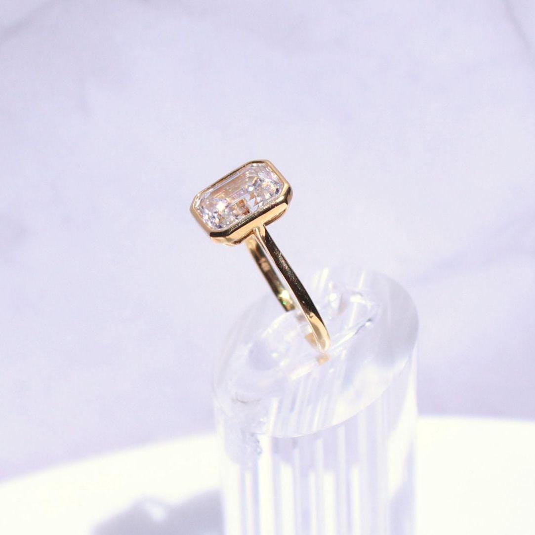14k Gold Emerald Cut Moissanite Casey Ring: Lightweight Bezel Setting