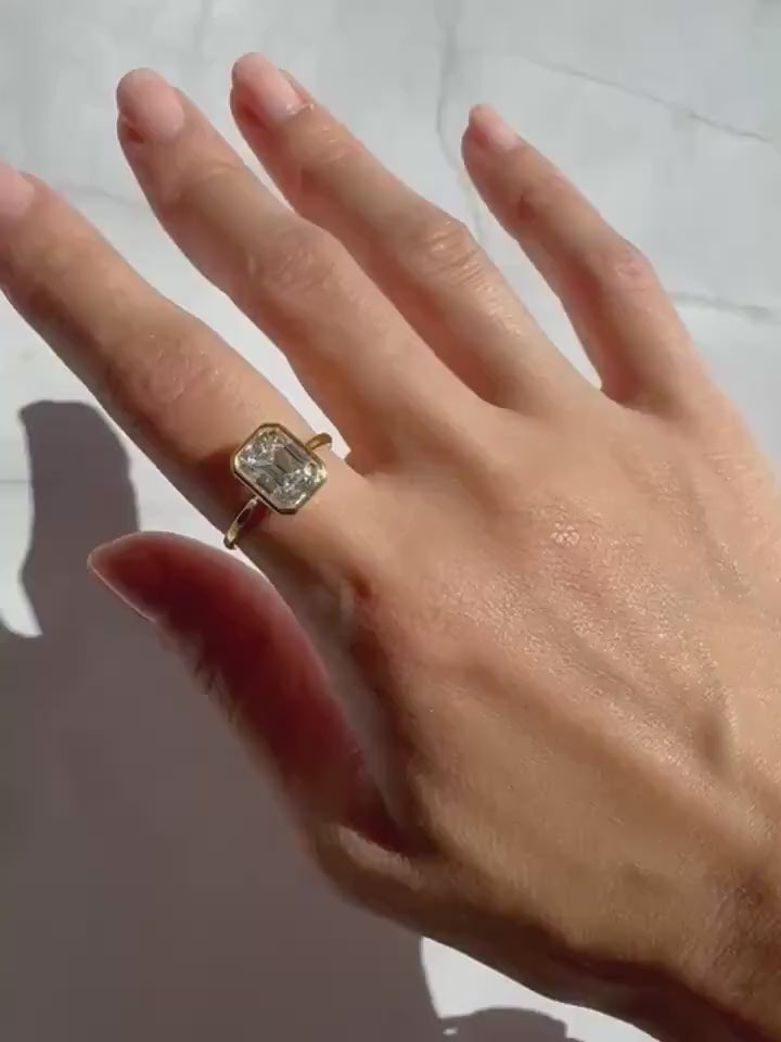 14k Gold Emerald Cut Moissanite Casey Ring: Lightweight Bezel Setting